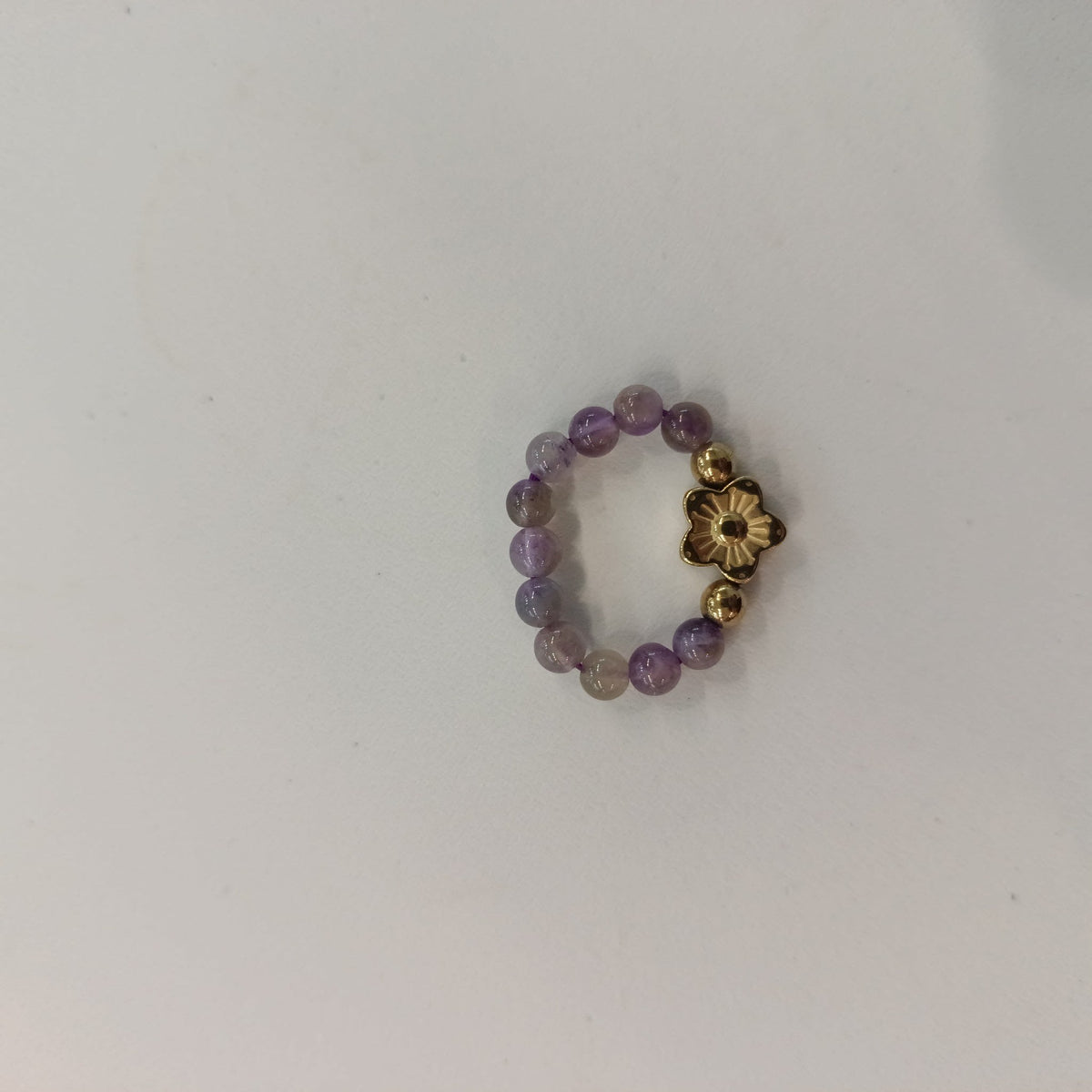Nephelie Stone & Soul Bead Ring Amethyst Bead Ring with Gold Flower Charm